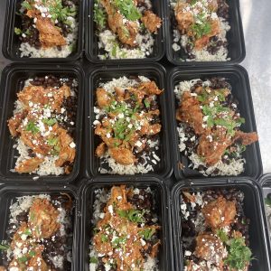 Chipotle Chicken with cilantro lime rice, black beans, cilantro and cotija cheese