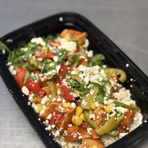 Ranchero Chicken with white rice, black beans, peppers, cotija and cilantro