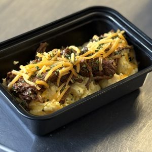Carnivore Birria Breakfast scrambled eggs, cheddar cheese and pico de gallo
