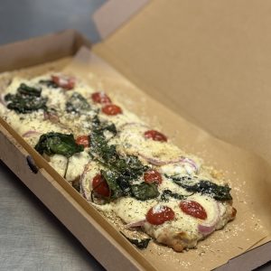 Florentine Pizza ground chicken crust, cottage cheese aflredo base, mozzarella cheese, spinach and tomato