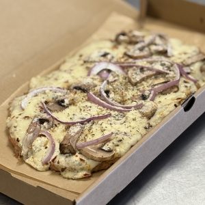 Crushed Red Pepper, Mushroom and Onion Ground Chicken Crust Pizza with our cottage cheese alfredo and mozzarella