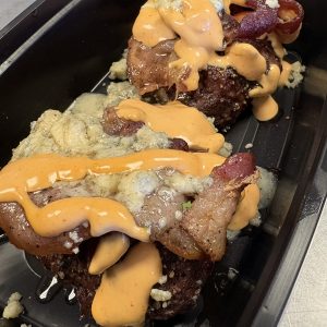 Blue cheese and bacon topped bison burgers with chipotle aioli