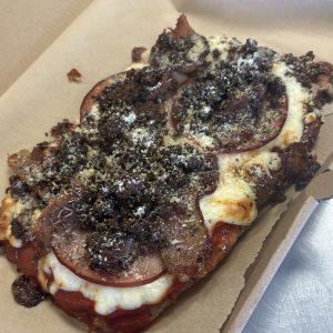 Meat Lovers Protein Pizza on our ground chicken crust with bison, ham, bacon, marinara and mozzarella