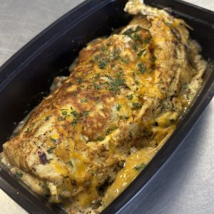 Bison, Chive and Cottage Cheese infused power omelet topped with shredded cheddar