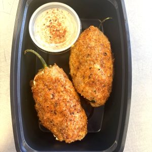 Carnivore Bombs Cheddar and Cream Cheese stuffed jalapeno wrapped in ground chicken with our yogurt-based ranch (great protein snack)